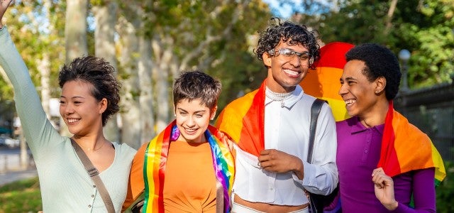 group photo with pride flag